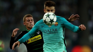 MOENCHENGLADBACH, GERMANY - SEPTEMBER 28:  Gerard Pique of Barcelona controls the ball ahead of Thorgan Hazard of Borussia Moenchengladbach  during the UEFA Champions League group C match between VfL Borussia Moenchengladbach and FC Barcelona at Borussia-Park on September 28, 2016 in Moenchengladbach, North Rhine-Westphalia.  (Photo by Alex Grimm/Bongarts/Getty Images)